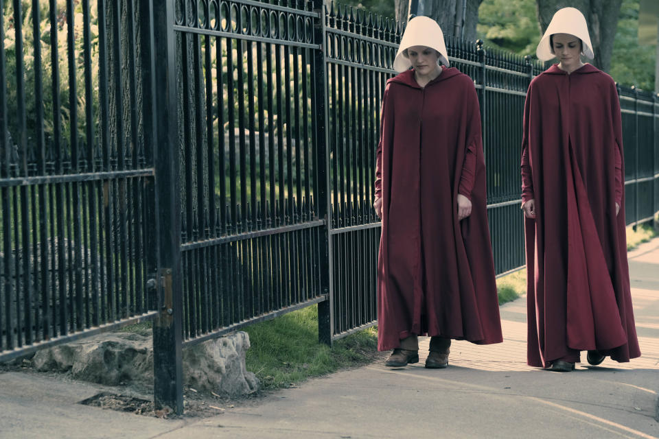 The Handmaid's Tale -- "Offred" -- Episode 101 -- Offred, one the few fertile women known as Handmaids in the oppressive Republic of Gilead, struggles to survive as a reproductive surrogate for a powerful Commander and his resentful wife. Offred (Elisabeth Moss) and Ofglen (Alexis Bledel), shown. (Photo by: George Kraychyk/Hulu)