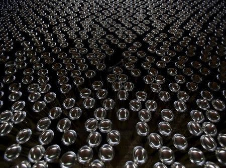 Aluminum cans are seen at the assembly line of Rexam Beverage Can in Jacarei, Brazil, June 25, 2015. REUTERS/Paulo Whitaker
