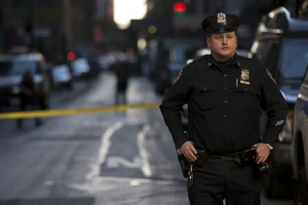 NYPD officers stand guard at the scene of an early morning shooting near Penn Station in Manhattan, New York, November 9, 2015. REUTERS/Brendan McDermid