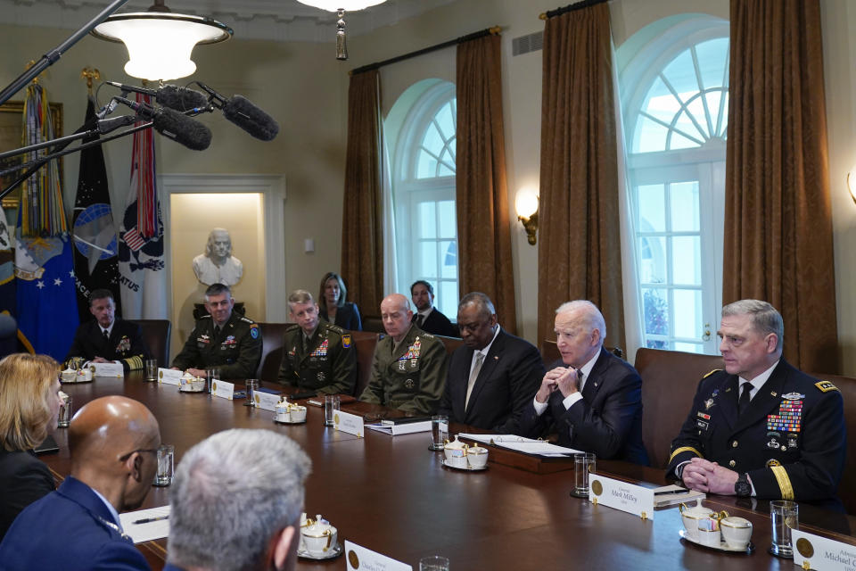 FILE - President Joe Biden speaks as he meets with his military leadership in the Cabinet Room at the White House, Wednesday, April 20, 2022, in Washington. Back from left are, Navy Adm. John Aquilino, commander of US Indo-Pacific Command; Gen. Daniel Hokanson, Chief of the National Guard Bureau; Gen. Stephen Townsend, commander of the US Africa Command; Gen. David Berger, Commandant of the Marine Corps; Defense Secretary Lloyd Austin; and Chairman of the Joint Chiefs of Staff Gen. Mark Milley. (AP Photo/Evan Vucci, File)