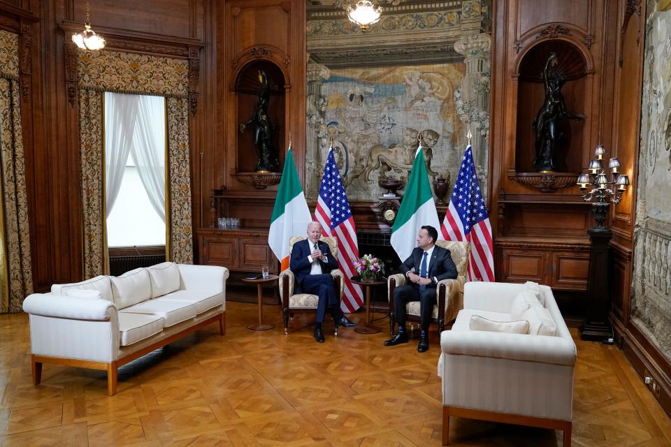 Biden and Varadkar speak before cameras in Farmleigh House (AP)