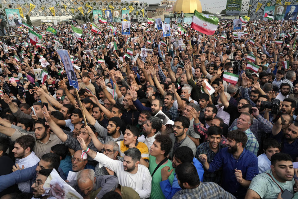 Supporters of Saeed Jalili, a candidate for the Iran's presidential election, attend his campaign meeting in Tehran, Iran, Monday, June 24, 2024. Comments suggesting that Iran's reformist presidential candidate could increase government-set gasoline prices have raised fears of a repeat of nationwide protests. (AP Photo/Vahid Salemi)