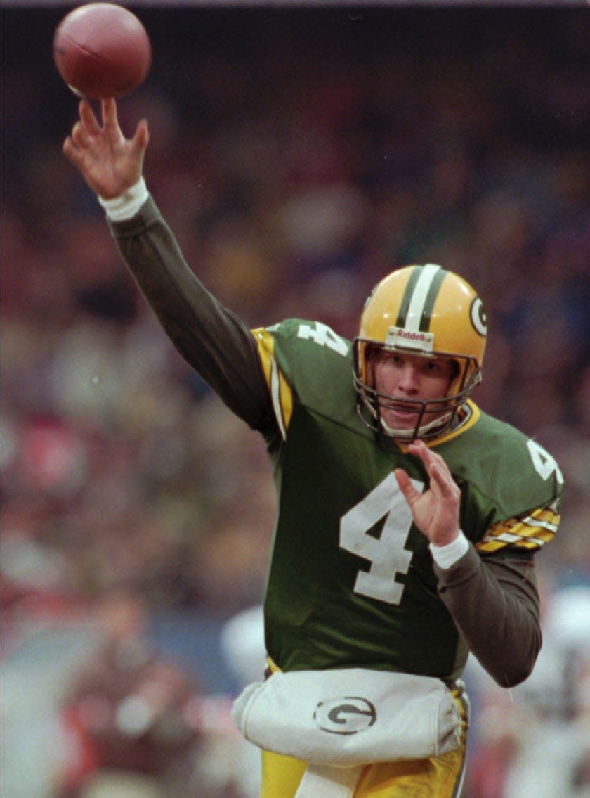 Green Bay Packers quarterback Brett Favre unleashes a pass against the Cleveland Browns on Sunday, Nov. 19, 1995, in Cleveland, Ohio.