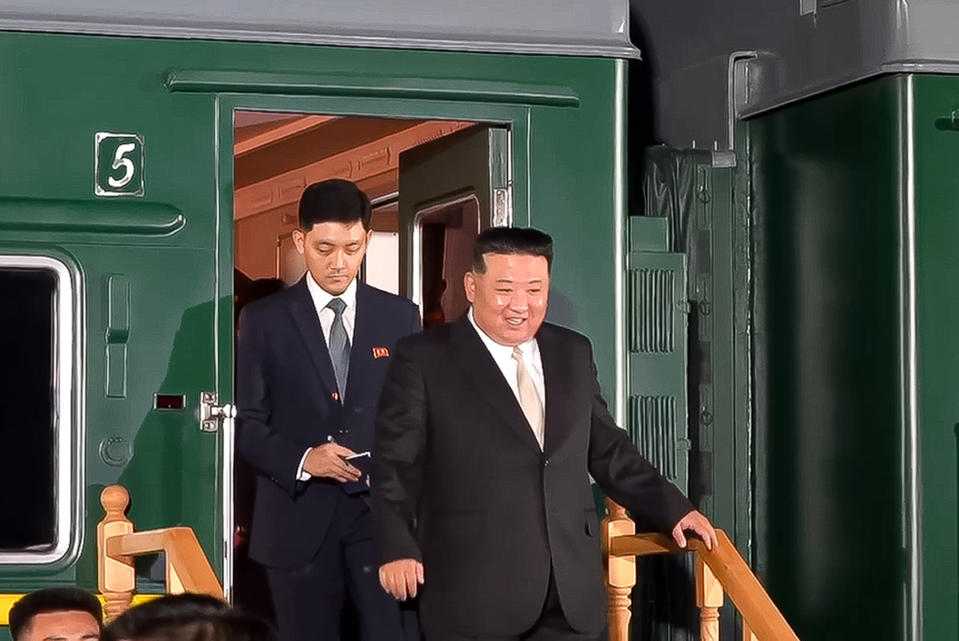 In this photo taken from video released by governor of the Russian far eastern region of Primorsky Krai Oleg Kozhemyako telegram channel on Tuesday, Sept. 12, 2023, North Korea's leader Kim Jong Un, foreground, steps down from his train after crossing the border to Russia at Khasan, about 127 km (79 miles) south of Vladivostok. North Korea's Kim Jong Un rolled into Russia on an armored train to see President Vladimir Putin. (Governor of the Russian far eastern region of Primorsky Krai Oleg Kozhemyako telegram channel VIA AP)