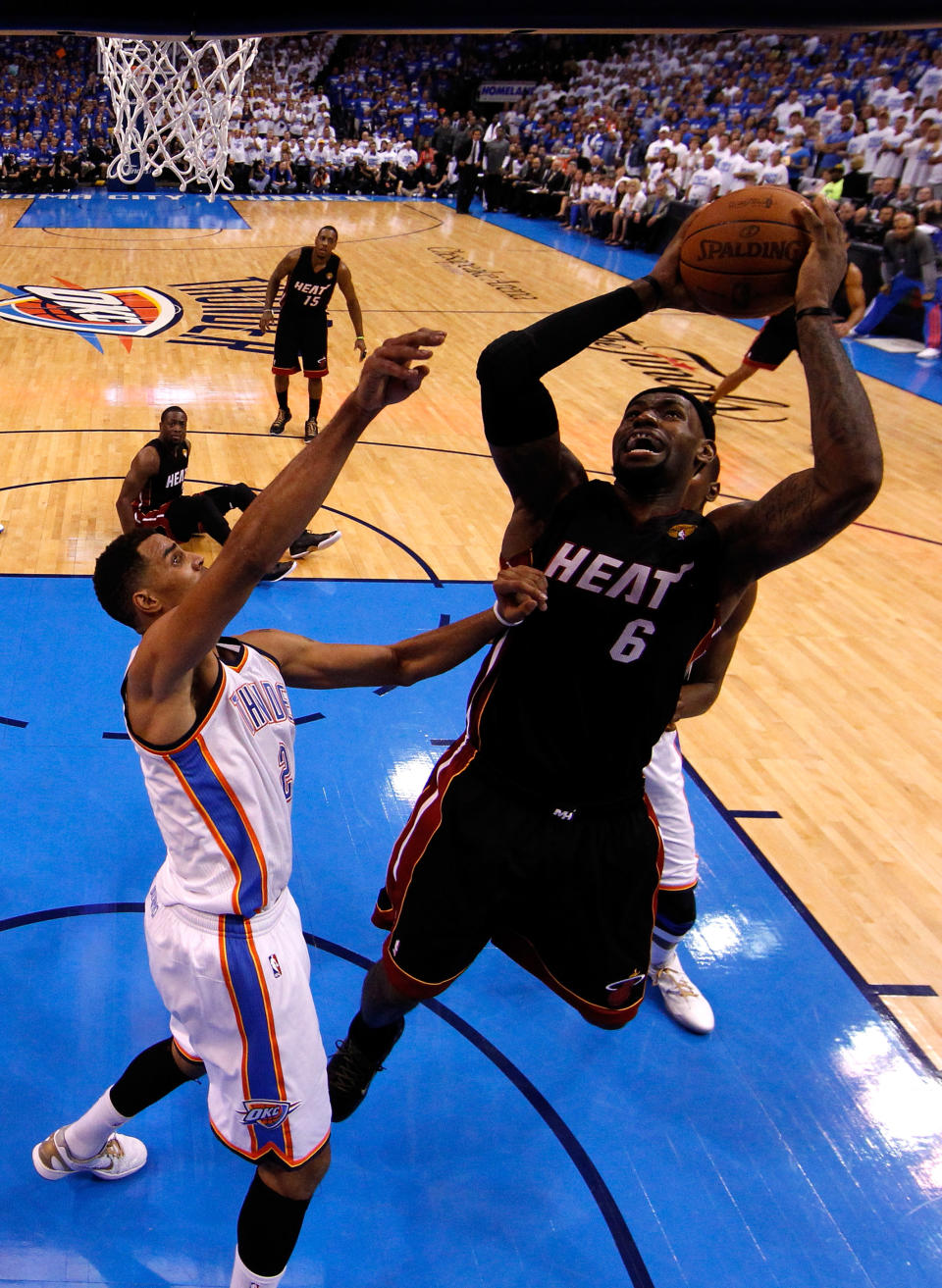 OKLAHOMA CITY, OK - JUNE 14: LeBron James #6 of the Miami HGeat oes up for a shot over Thabo Sefolosha #2 of the Oklahoma City Thunder in the second half in Game Two of the 2012 NBA Finals at Chesapeake Energy Arena on June 14, 2012 in Oklahoma City, Oklahoma. NOTE TO USER: User expressly acknowledges and agrees that, by downloading and or using this photograph, User is consenting to the terms and conditions of the Getty Images License Agreement. (Photo by Jim Young/Pool/Getty Images)