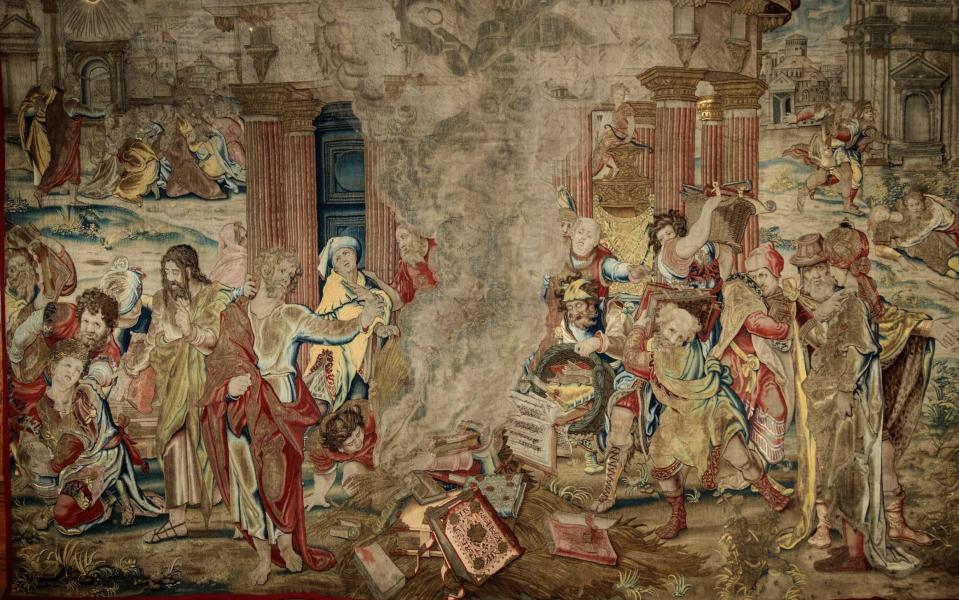 Chilling scene: tapestry showing St Paul burning heathen books, 1530s
