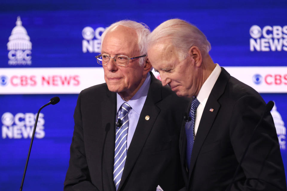 CHARLESTON, SOUTH CAROLINA - FEBRUARY 25: Democratic presidential candidates Sen. Bernie Sanders (I-VT) and former Vice President Joe Biden speak during a break at the Democratic presidential primary debate at the Charleston Gaillard Center on February 25, 2020 in Charleston, South Carolina. Seven candidates qualified for the debate, hosted by CBS News and Congressional Black Caucus Institute, ahead of South Carolina’s primary in four days.  (Photo by Win McNamee/Getty Images)