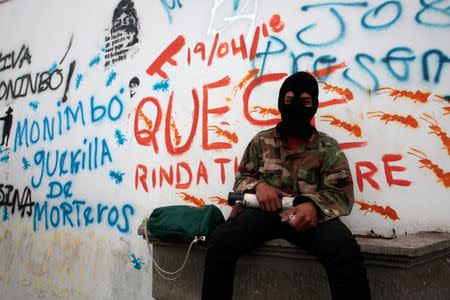 A demonstrator poses for a photo, as he takes part in the funeral service of Jose Esteban Sevilla Medina, who died during clashes with pro-government supporters in Monimbo, July 16. REUTERS/Oswaldo Rivas