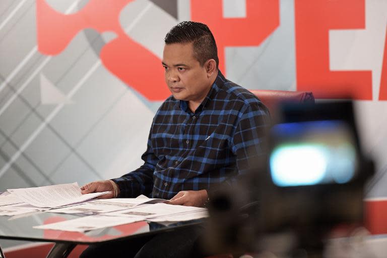 Chairman of the Red Shirts movement, Jatuporn Prompan, pictured during his live show on Peace TV, at a studio in Bangkok, on October 10, 2014