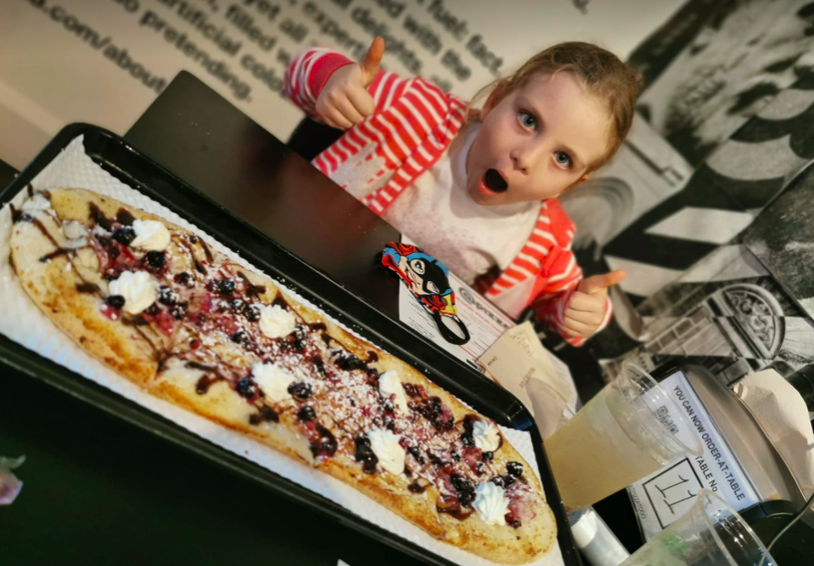 Daniel Davies-Luke's daughter Luna gets ready to tuck into a meal at @Pizza in Edinburgh. (Daniel Davies-Luke)