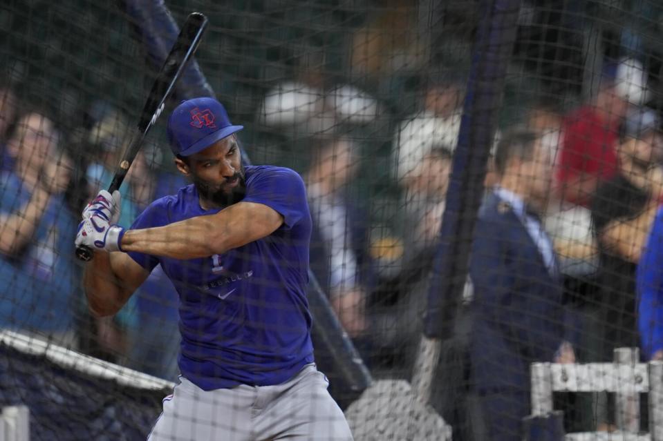 Texas Rangers' Marcus Semien takes batting practice.