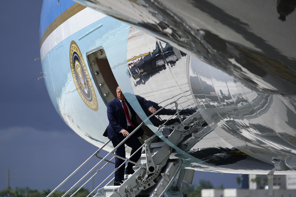 President Donald Trump pauses as he boards Air Force One at Miami International Airport on Friday, July 10, 2020. (AP Photo/Evan Vucci)