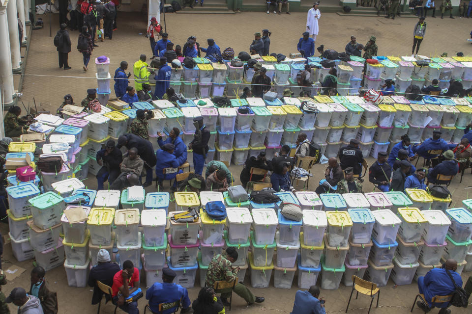 Ballot boxes lie stacked in rows at a tallying center in Nairobi, Kenya Wednesday, Aug. 10, 2022. Kenyans are waiting for the results of a close but calm presidential election in which the turnout was lower than usual. (AP Photo)