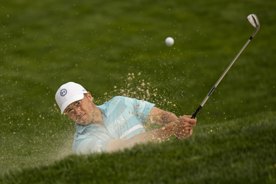 Jordan Spieth hits hits from the bunker on the 13th hole during a practice around for the PGA Championship golf tournament at Oak Hill Country Club on Tuesday, May 16, 2023, in Rochester, N.Y. (AP Photo/Eric Gay)