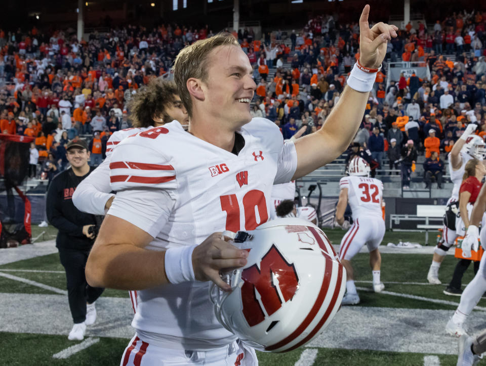 CHAMPAIGN, ILLINOIS – OCTOBER 21: Braedyn Locke #18 of the Wisconsin Badgers celebrates following the game against the Illinois Fighting Illini at Memorial Stadium on October 21, 2023 in Champaign, Illinois. (Photo by Michael Hickey/Getty Images)