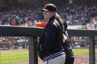 San Francisco Giants major league assistant coach Alyssa Nakken stands in the dugout during the fourth inning of a baseball game against the San Diego Padres in San Francisco, Friday, April 5, 2024. (AP Photo/Jeff Chiu)