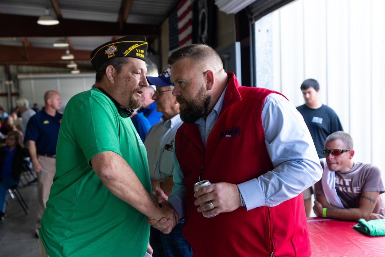 J.R. Majewski shakes hands with a veteran at a VFW event.