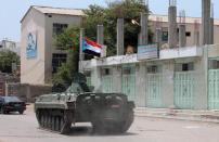 A tank flying the flag of the southern separatist movement is pictured in the southern Yemeni city of Aden on March 30, 2015 as a coalition continued to defend the city from Shiite Huthi militia