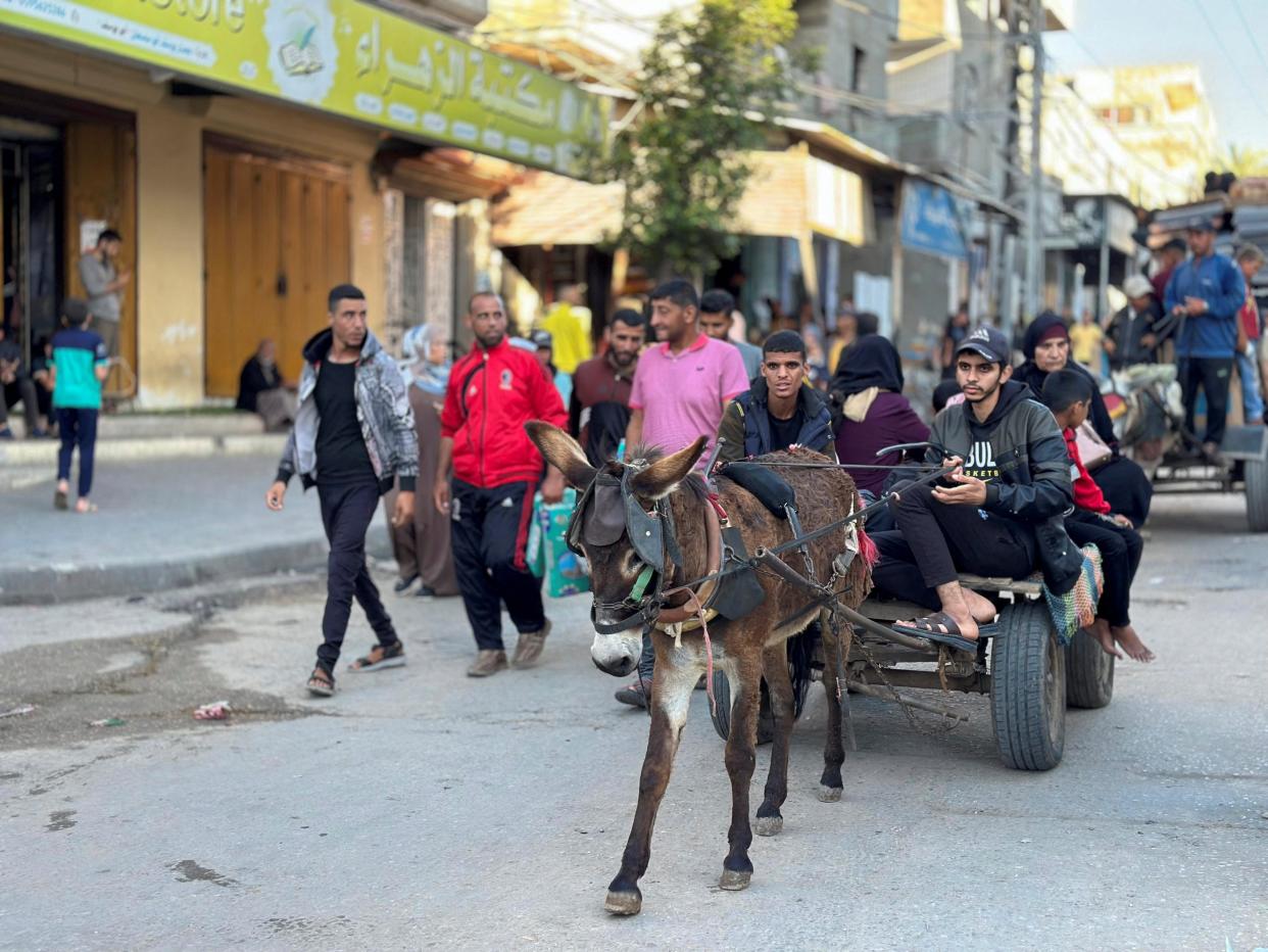 People flee the eastern parts of Rafah, after the Israeli military began evacuating Palestinian civilians ahead of a threatened assault on the southern Gazan city, amid the ongoing conflict between Israel and Hamas, in Rafah, southern Gaza Strip, 6 May  2024 (Reuters)