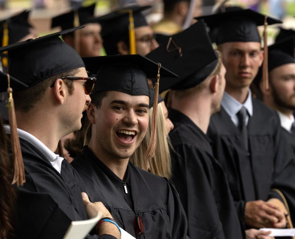 Tyler Fyfe, one of 31 Adrian College students to earn a graduate degree Sunday, smiles for the camera during AC's commencement ceremony. Fyfe, whose hometown is Vancouver, British Columbia, Canada, earned a Master of Arts in sport management.
