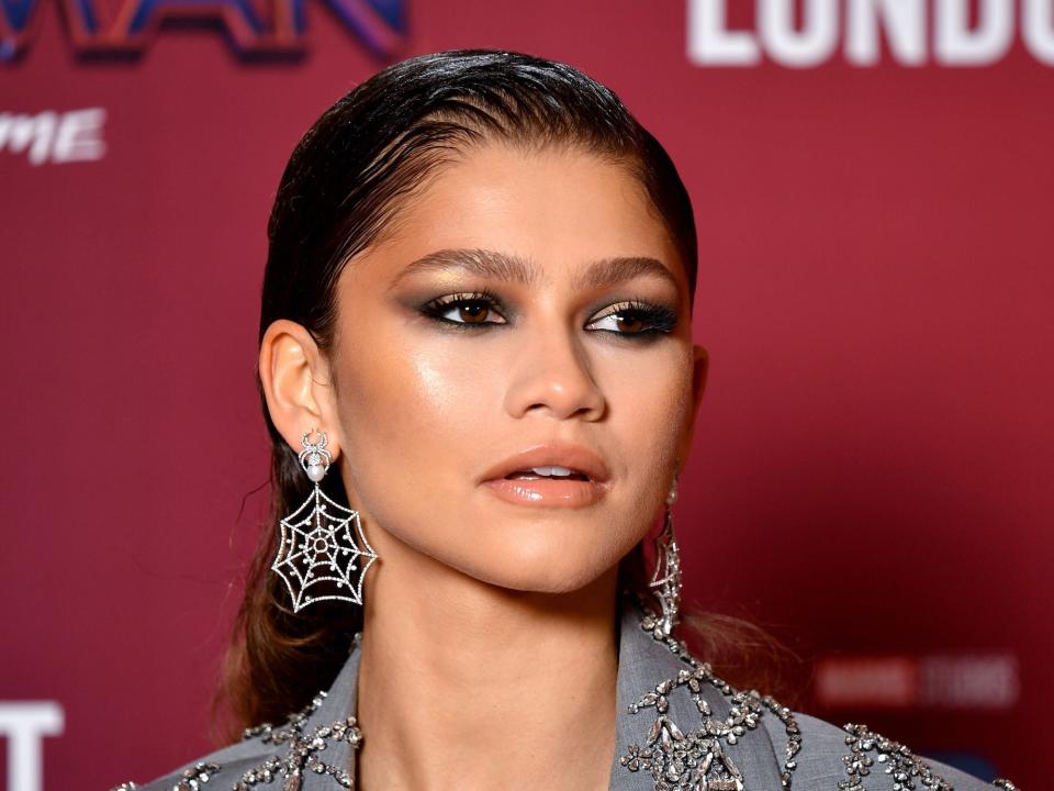 Zendaya wears spider earrings at a "Spider-Man: No Way Home" event.