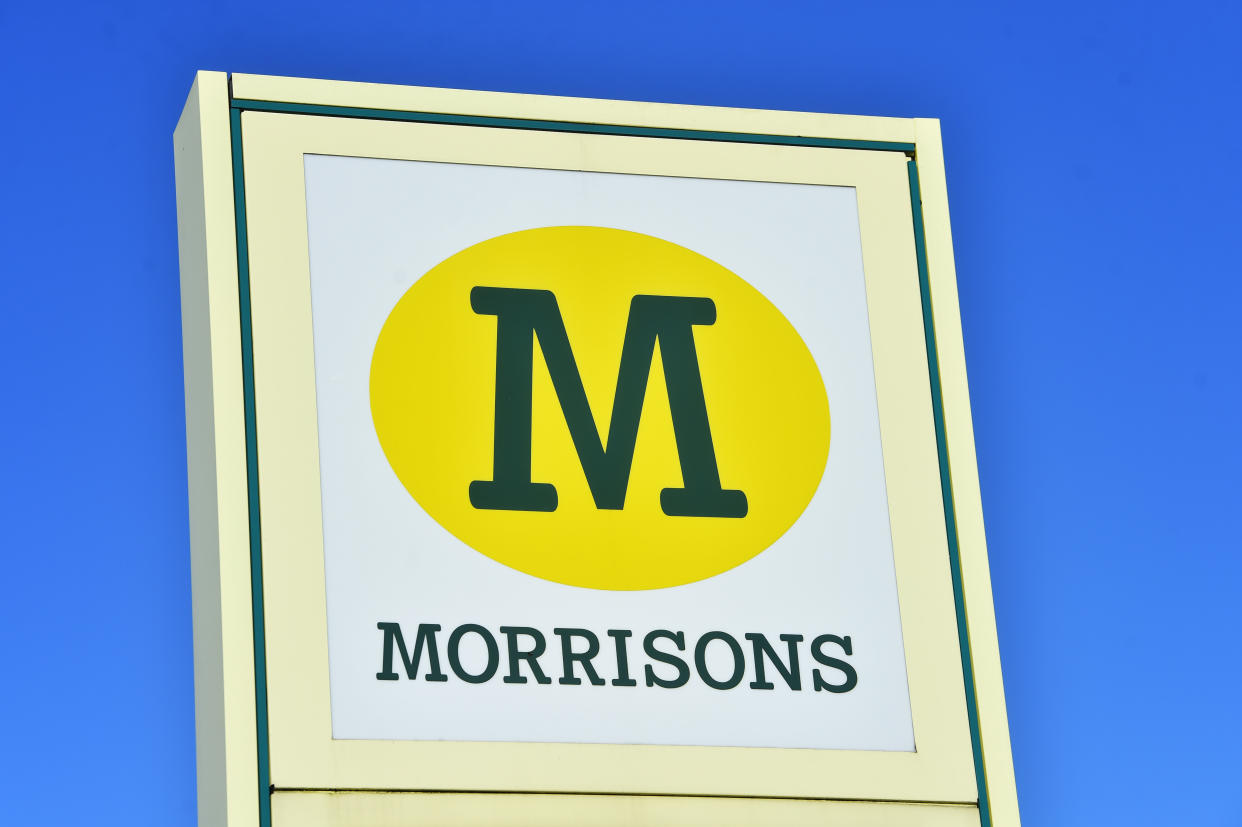 NEWCASTLE-UNDER-LYME- NOVEMBER 13:  A logo of Supermarket company, Morrisons is seen outside one of its stores on November 13, 2020 in Newcastle-Under-Lyme, Staffordshire . (Photo by Nathan Stirk/Getty Images)