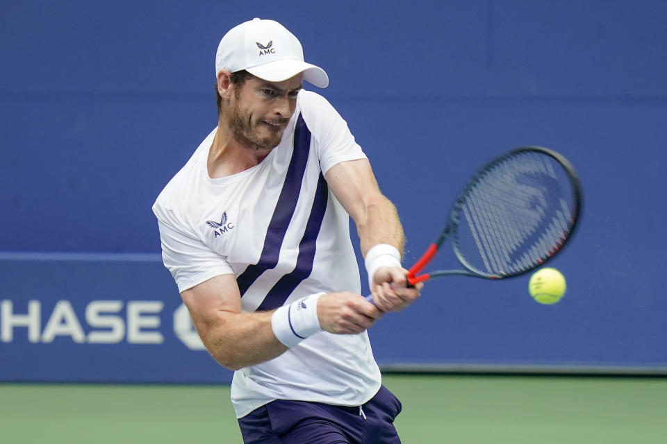 Andy Murray, of Great Britain, returns a shot to Yoshihito Nishioka, of Japan, during the first round of the US Open tennis championships, Tuesday, Sept. 1, 2020, in New York. (AP Photo/Seth Wenig)