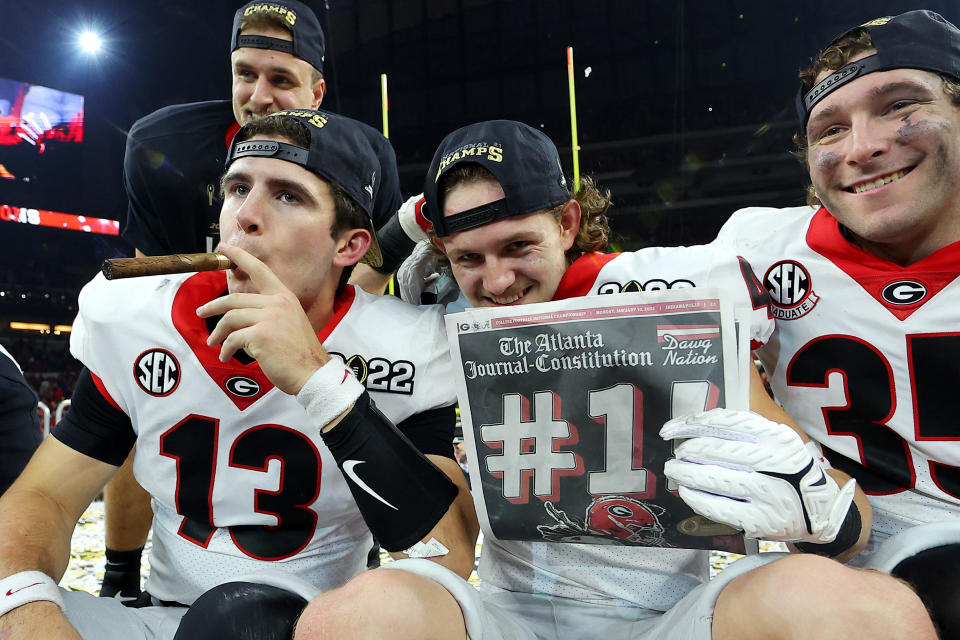 INDIANAPOLIS, INDIANA - JANUARY 10: Georgia Bulldogs players celebrate after the Georgia Bulldogs defeated the Alabama Crimson Tide 33-18 in the 2022 CFP National Championship Game at Lucas Oil Stadium on January 10, 2022 in Indianapolis, Indiana. (Photo by Kevin C. Cox/Getty Images)