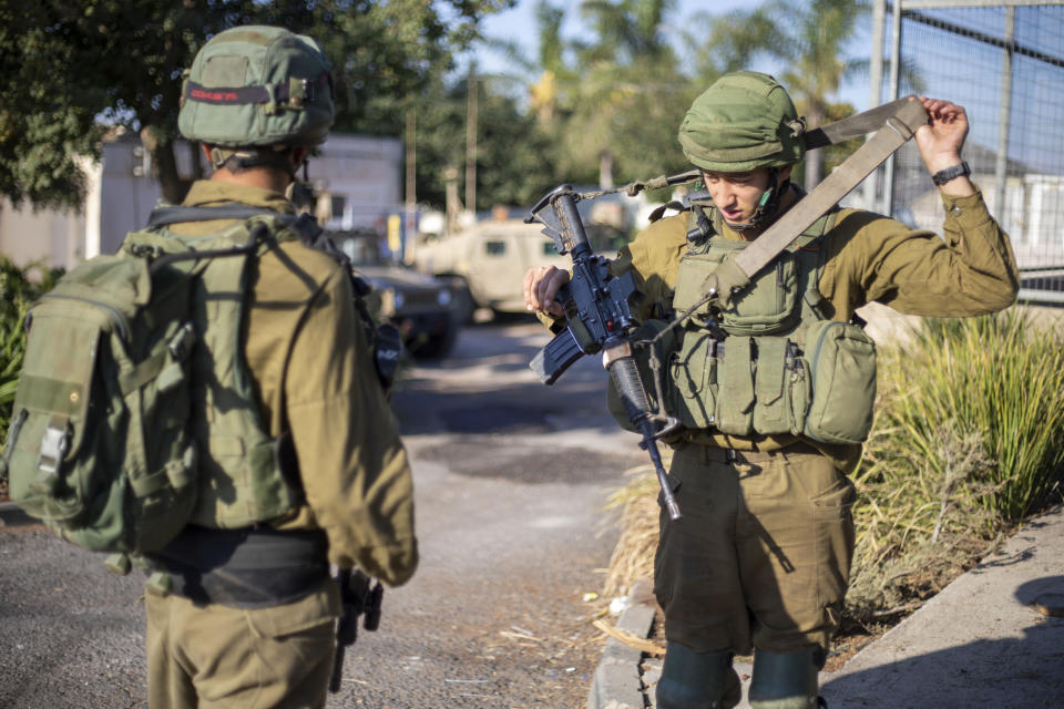Israeli soldiers secure the village of Avivim on the Israel-Lebanon border, Monday, Sept. 2, 2019. Hezbollah militants on Sunday fired a barrage of anti-tank missiles into Israel, prompting a reprisal of heavy Israeli artillery fire in a rare burst of fighting between the bitter enemies. (AP Photo/Ariel Schalit)