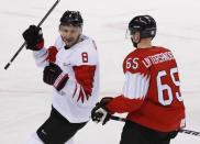 Ice Hockey – Pyeongchang 2018 Winter Olympics – Men Preliminary Round Match - Switzerland v Canada - Kwandong Hockey Centre, Gangneung, South Korea – February 15, 2018 - Wojciech Wolski of Canada (L) celebrates after scoring against Switzerland. REUTERS/Grigory Dukor