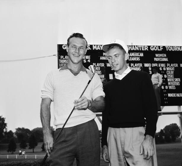 Arnold Palmer (left) and Eddie Merrins in 1954, when the finished 1-2 in the All American amateur golf tournament.