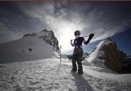 FILE - In this Thursday, Jan.18, 2018 file photo, United States' Lindsey Vonn prepares for an alpine ski, women's World Cup downhill training, in Cortina D'Ampezzo, Italy. The women's all-time leader in World Cup wins announced Friday, Feb. 1, 2019 that she will retire from ski racing after this month's world championships in Sweden. The 34-year-old Vonn had been planning to retire in December but changed her plans because of persistent pain in both of her knees, which she fully realized after failing to finish a race in Cortina d'Ampezzo, Italy, last month. (AP Photo/Gabriele Facciotti, File)