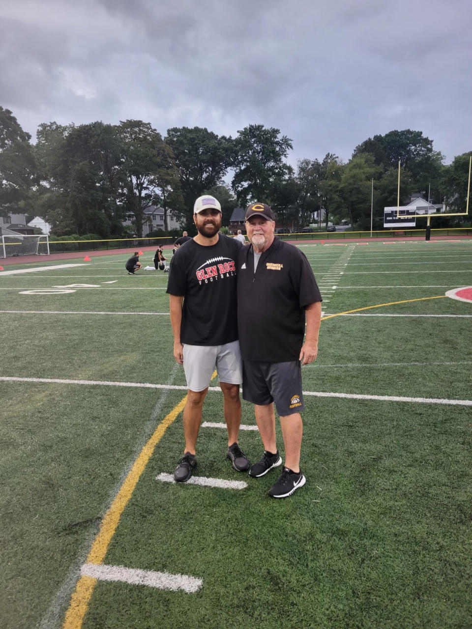 New Glen Rock head football coach Kyle McCourt with his father Mike before a scrimmage between Cresskill and Glen Rock.