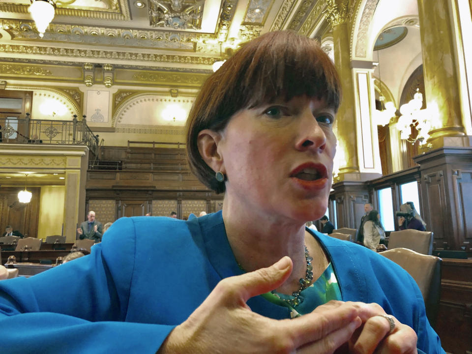 In this Thursday, May 16, 2019 photo, State Sen. Heather Steans, D-Chicago, explains changes to her legislation to legalize recreational use of marijuana in Springfield, Ill. During debate on the Illinois budget the weekend of June 1, 2019, Steans learned that an agreed-to freeze on lawmaker raises was left out of legislation, so she amended another bill to include the freeze and sent it to the House, but the House took no action, so the 2.4% raise takes effect. (AP Photo/John O’Connor)