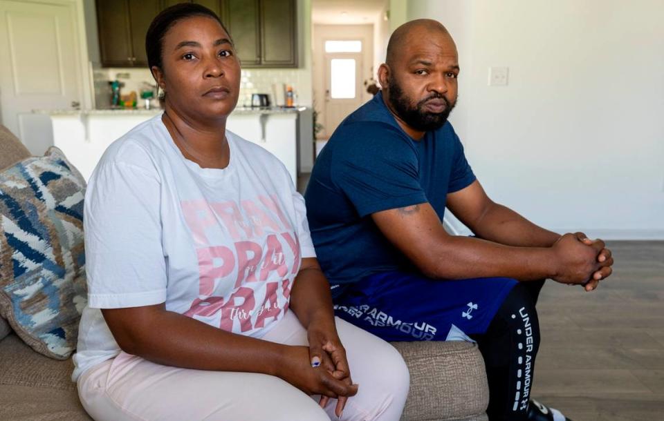 Rotesha McNeil and her husband, Jermaine McNeil, photographed in their home on Aug. 16 in Clayton, N.C. McNeil signed onto a potential class action suit alleging her civil rights were violated when she was arrested on warrants that should have been recalled from the state’s new eCourts system.