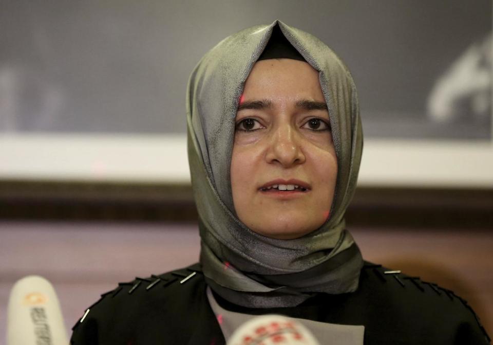 Fatma Betul Sayan Kaya, Turkey's Minister of Family Affairs, who was escorted back to the German border after a long standoff outside the Turkish consulate in Rotterdam, speaks to the media at Ataturk Airport after her return to Turkey, in Istanbul, Sunday, March 12, 2017. The escalating dispute between Turkey and the Netherlands spilled over into Sunday, with a Turkish minister unable to enter her consulate after the authorities there had already blocked a visit by the foreign minister, prompting Turkish President Recep Tayyip Erdogan to call the Dutch " fascists." (AP Photo)