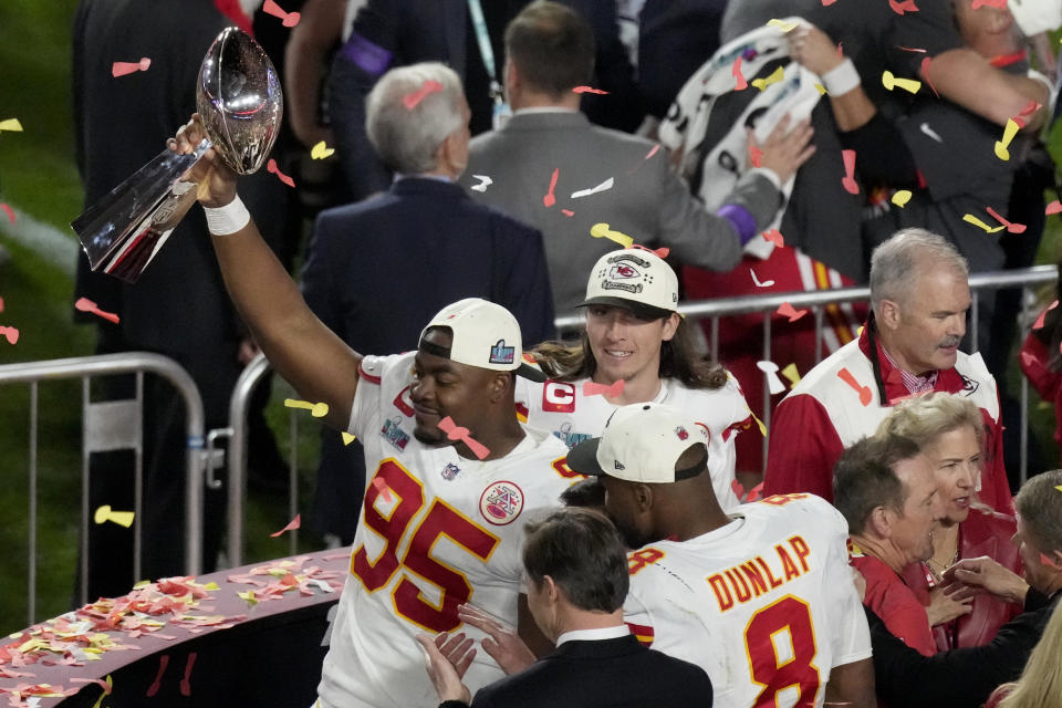 Kansas City Chiefs defensive tackle Chris Jones (95) holds the Vince Lombardi Trophy after the NFL Super Bowl 57 football game against the Philadelphia Eagles, Sunday, Feb. 12, 2023, in Glendale, Ariz. The Chiefs defeated the Eagles 38-35. (AP Photo/Charlie Riedel)