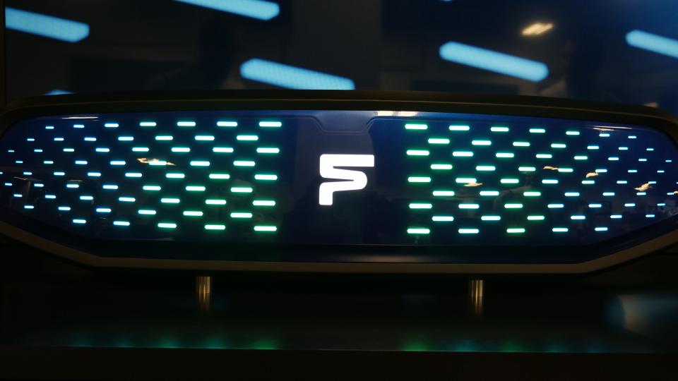 LED lights create a logo and decorative lights on a vehicle's grille panel.