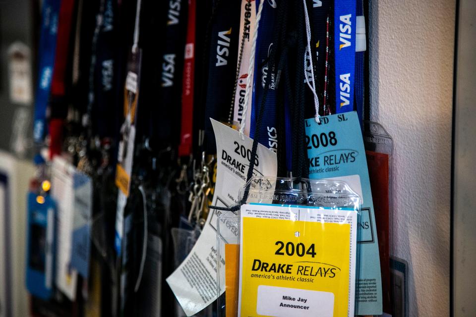 Lanyards and credentials from events Mike Jay has done commentary at are displayed, Wednesday, April 20, 2022, in Tiffin, Iowa.