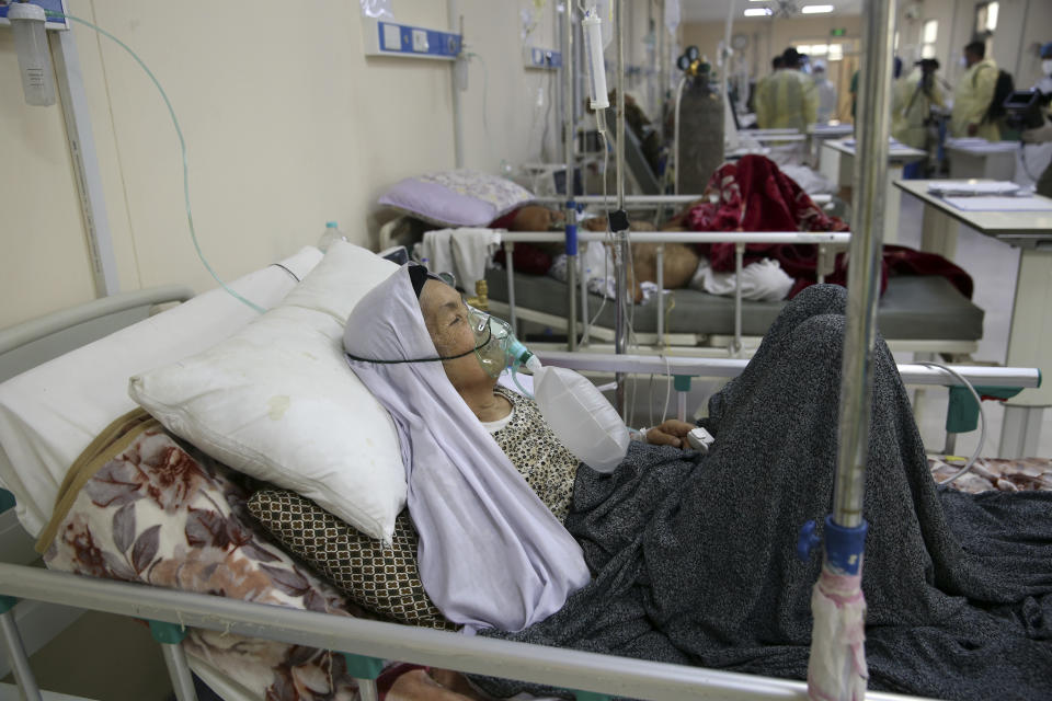 A patient is connected to oxygen tank in the Intensive Care Unit ward for COVID-19 patients at the Afghan-Japan Communicable Disease Hospital in Kabul, Afghanistan, Tuesday June 30, 2020. (AP Photo/Rahmat Gul)