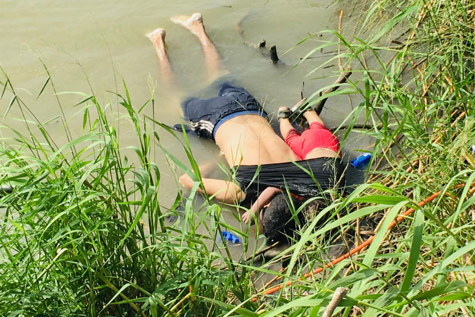 EDS NOTE: GRAPHIC CONTENT - The bodies of Salvadoran migrant Oscar Alberto MartÃ­nez RamÃ­rez and his nearly 2-year-old daughter Valeria lie on the bank of the Rio Grande in Matamoros, Mexico, Monday, June 24, 2019, after they drowned trying to cross the river to Brownsville, Texas. Martinez' wife, Tania told Mexican authorities she watched her husband and child disappear in the strong current. (AP Photo/Julia Le Duc)