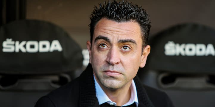 Barcelona manager Xavi sits on the bench during the game against Valencia on February 20, 2022 at the Mestalla Stadium. Credit: Alamy