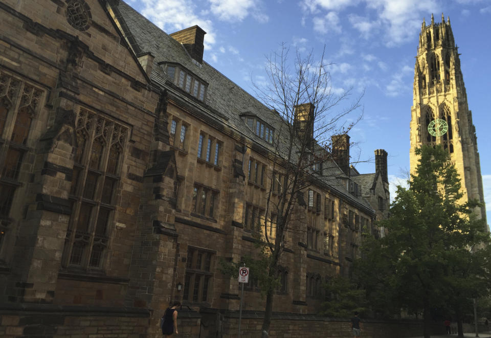 FILE - This Sept. 9, 2016 photo shows Harkness Tower on the campus of Yale University in New Haven, Conn. Dozens of people were charged Tuesday, March 12, 2019, in a scheme in which wealthy parents allegedly bribed college coaches and other insiders to get their children into some of the nation's most elite schools. The coaches worked at such schools as Yale, Wake Forest, Stanford, Georgetown, the University of Texas, the University of Southern California and the University of California, Los Angeles. A former Yale soccer coach pleaded guilty and helped build the case against others. (AP Photo/Beth J. Harpaz, File)