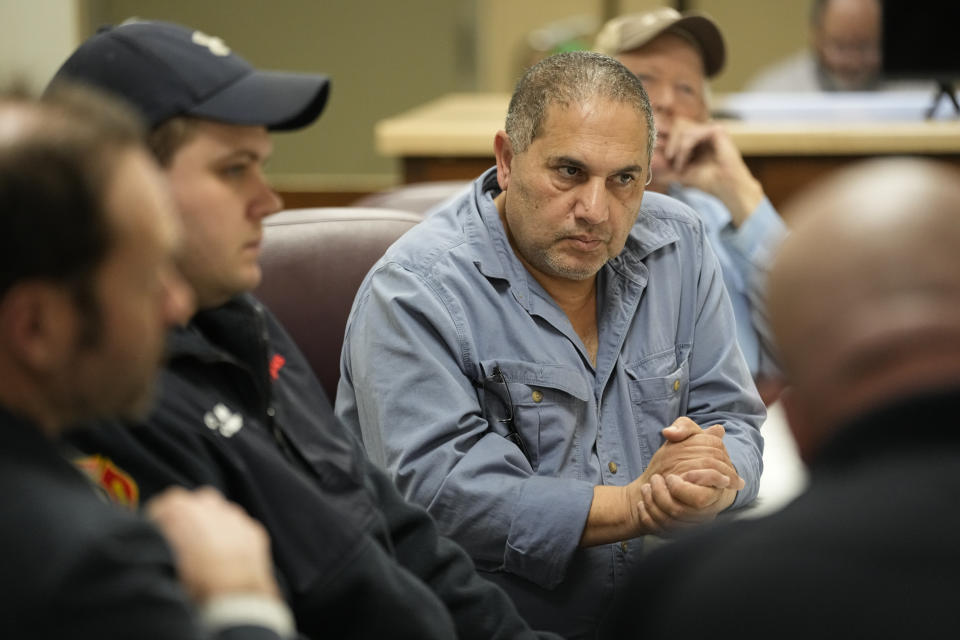 Mason, Tenn., Mayor Eddie Noeman listens during a meeting with city officials and members of Tennessee Emergency Management Agency, Wednesday, Jan. 24, 2024, in Mason, Tenn. The town has been managing a water crisis for several days after a winter storm brought sub-freezing temperatures and snow to and caused pipes to freeze over and break, creating leaks that lowered water pressure. (AP Photo/George Walker IV)