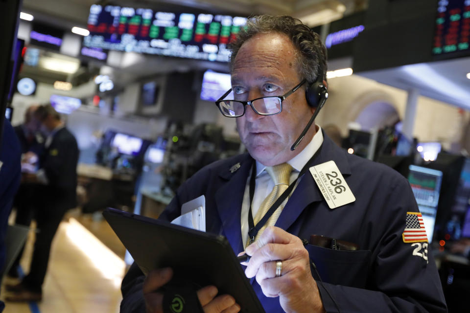 Trader Steven Kaplan works on the floor of the New York Stock Exchange, Tuesday, Nov. 12, 2019. Stocks are opening slightly higher on Wall Street, led by gains in technology and health care companies. (AP Photo/Richard Drew)