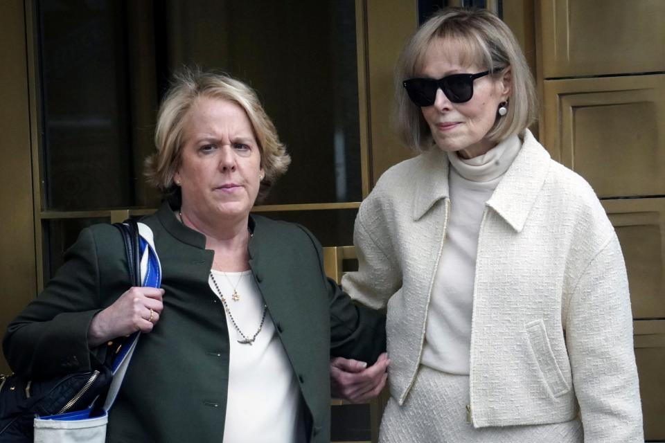 Former advice columnist E. Jean Carroll, right, leaves federal court with her lawyer, Roberta Kaplan, on April 27, 2023, in New York.