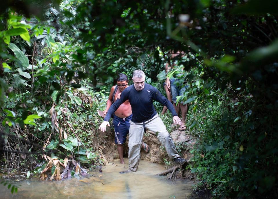 Phillips, right, and a Yanomami indigenous man in Maloca Papiu village, Roraima state, in 2019 (AP)