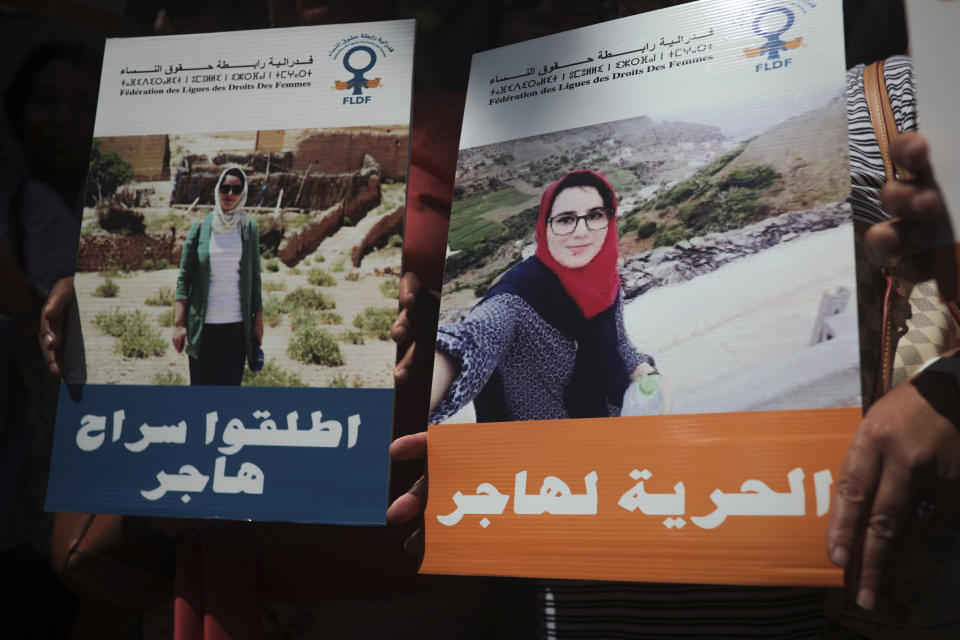 People carry banners at a demonstration outside a court in solidarity with detained journalist Hajar Raissouni, in Rabat, Morocco, Monday, Sept. 9, 2019. Banners in Arabic read "Free Hajar" and "No to criminalizing consensual relationships". (AP Photo/Mosa'ab Elshamy)