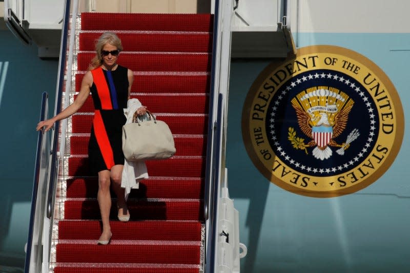 White House advisor Kellyanne Conway deplanes as she arrives with U.S. President Donald Trump aboard Air Force One at Joint Base Andrews, Maryland, U.S. April 28, 2017. REUTERS/Jonathan Ernst 