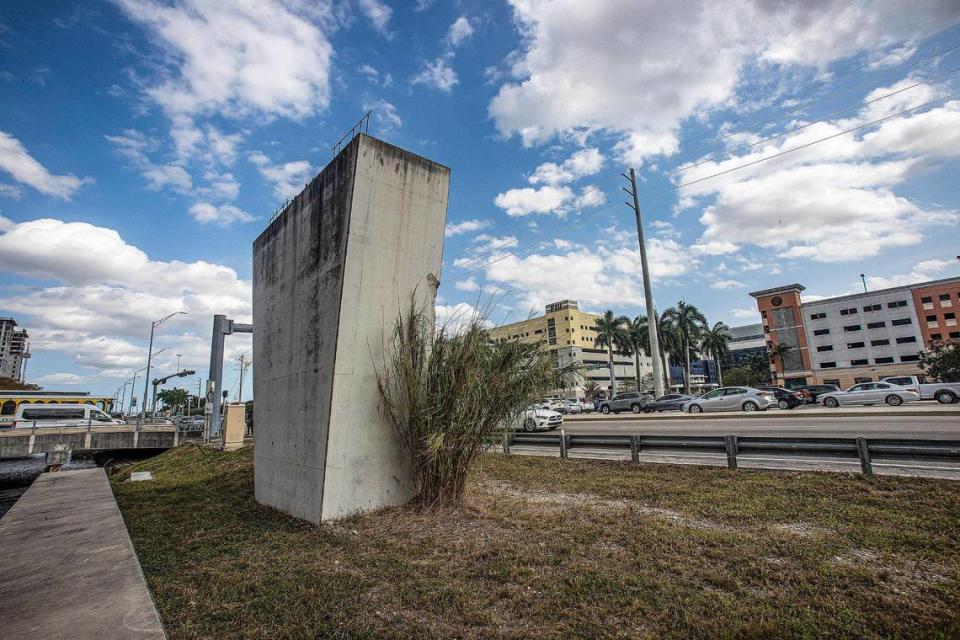 A lone support pylon is all that remains of a pedestrian bridge over Southwest Eighth Street that collapsed while under construction in 2018. The column, on the north side of the road at 109th Avenue, will be demolished once construction starts in early 2024 on a proposed new bridge linking Sweetwater’s University City district and FIU’s main campus, seen at right.